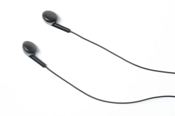 İzole edilmiş beyaz arka grupta müzik çalar ve akıllı telefon için kulaklık