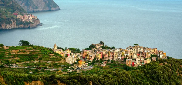 Corniglia Cinque Terre (Italian Riviera Liguria) and Manarola in the background — Stock Photo, Image