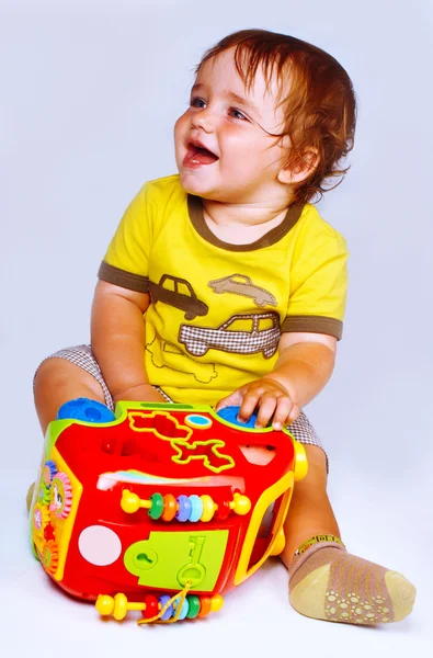 Menino com brinquedos — Fotografia de Stock