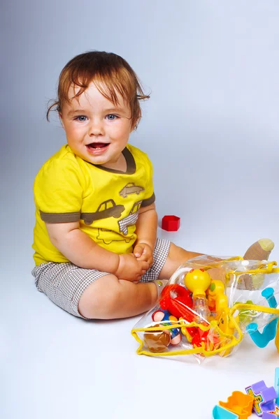 Menino com brinquedos — Fotografia de Stock