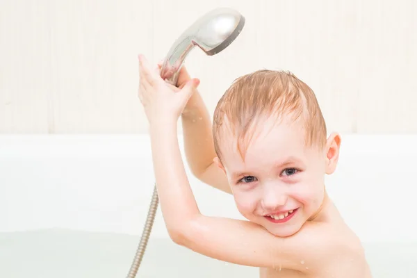 Cute 4 year-old boy bathes in a shower — Stock Photo, Image