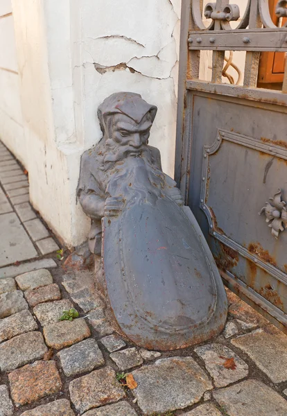 Dwarf shape old wheel guard (bollard) in Lodz, Poland — Stock Photo, Image