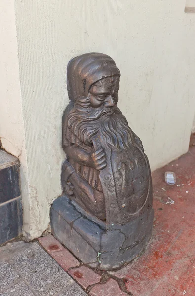 Dwarf shape old wheel guard (bollard) in Lodz, Poland — Stock Photo, Image