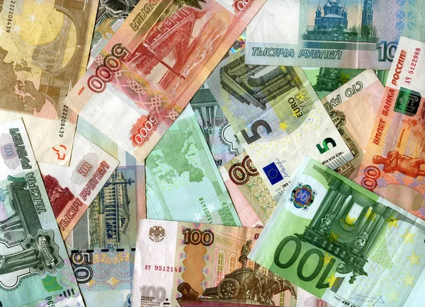 Achtergrond. Eurobankbiljetten en Rusland roebels — Stockfoto