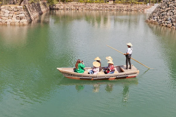 Ride on traditional boat in Takamatsu castle, Japan