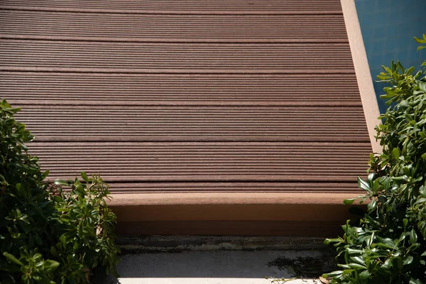 Composite Deck covered bridge over swimming pool.