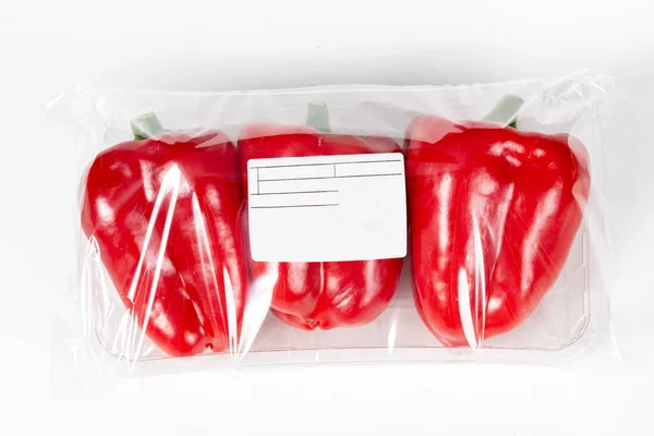 3 red bell pepper packed and labeled on white background
