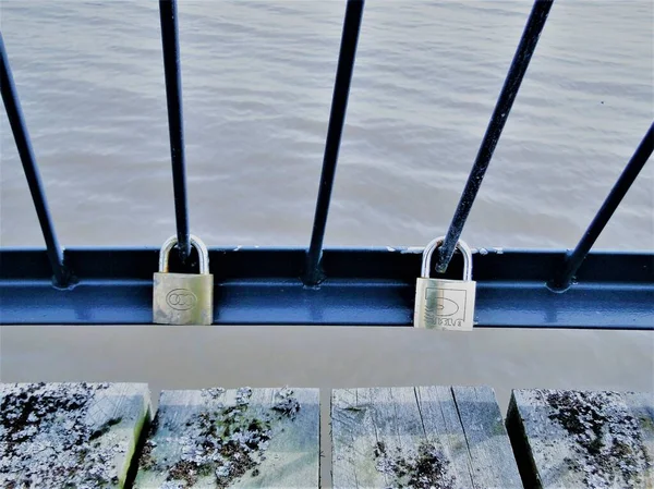 two padlocks on the bridge