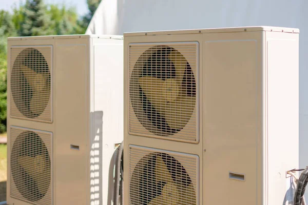 a split system air conditioner unit outdoors with air cleaning equipment
