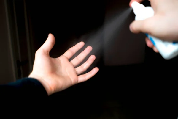 The using a spray antibacterial bottle to wash hands, healthcare sanitizer protection — Stockfoto