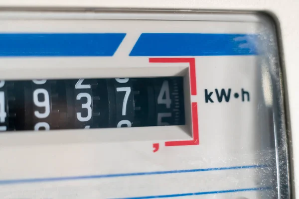 A macro view of electricity watt meter, kilowatt calculator counter at home, savings economy — Stockfoto