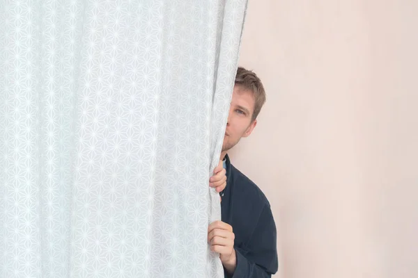 A person with half covered face oversee peek and spy, the lookout — Stock Photo, Image