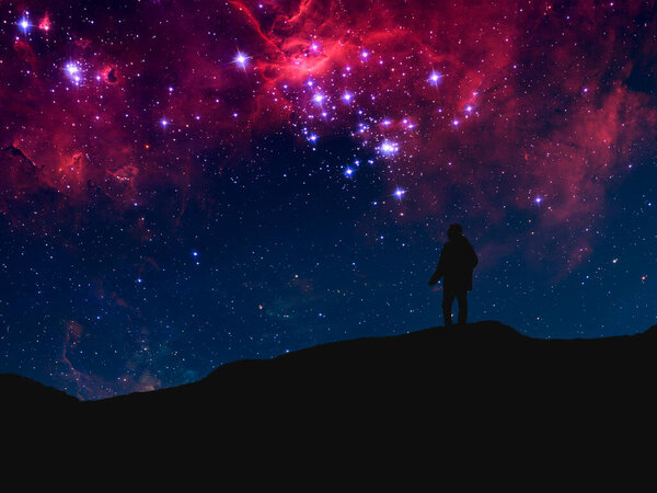 Silhouette of a person standing on top of mountain and watch the sky galaxy. elements of this image furnished by nasa