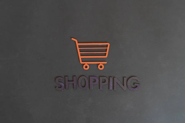 Ein Warenkorb-Icon-Konzept ausgeschnittene Buchstaben, Verkauf Geschäft, einfache minimalistische — Stockfoto