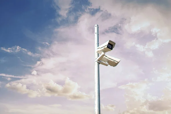 a cctv camera in the city street, big brother and privacy concept