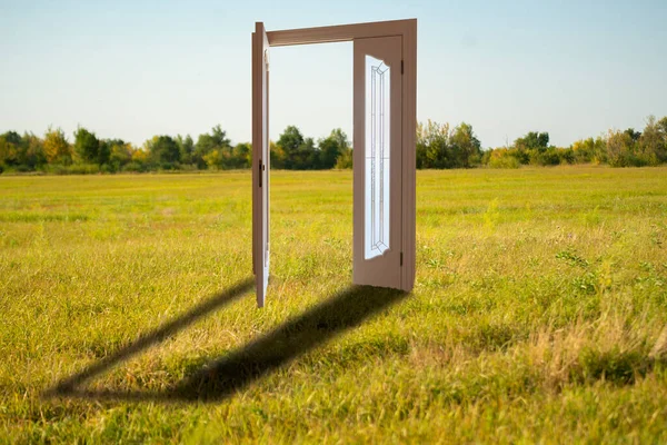 An opened door into the new workld, entrance to another life creative idea — Stock Photo, Image