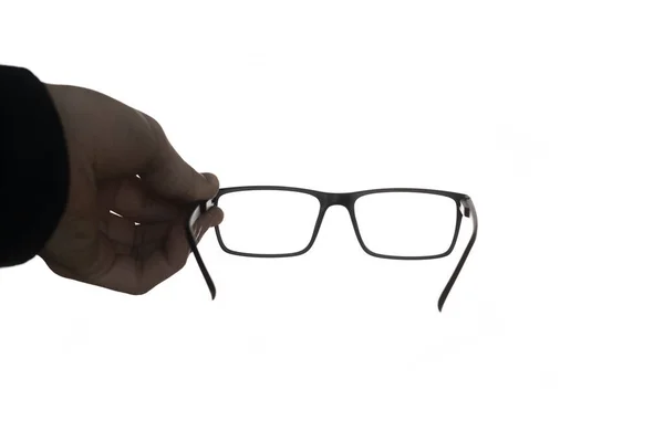 Un aislado en personas blancas mano sosteniendo un anteojos, diseño de maqueta, marco óptico — Foto de Stock