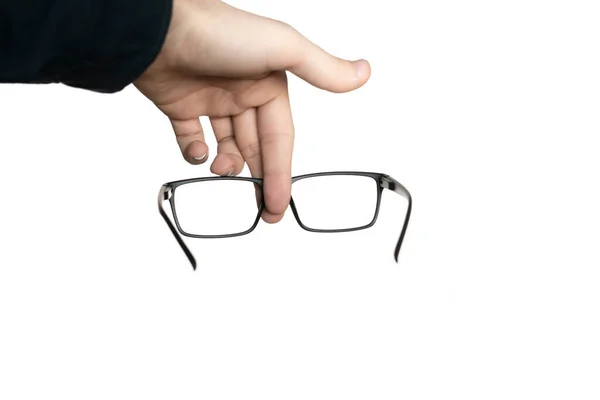 Egy elszigetelt fehér személy kezében egy szemüveg, mockup design, optikai keret — Stock Fotó