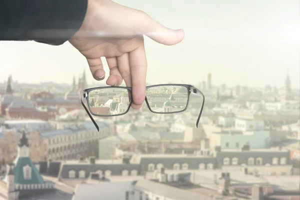 an optical eyevision concept, frame of eyeglasses show focused image on the blurred background