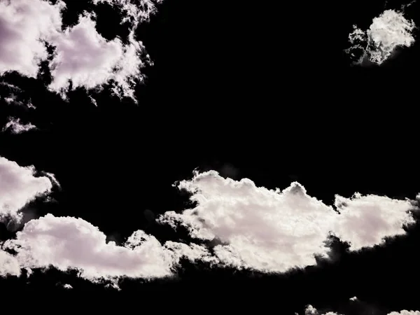 A cloudy sky with some clouds in stormy weather isolated on black background — Foto de Stock