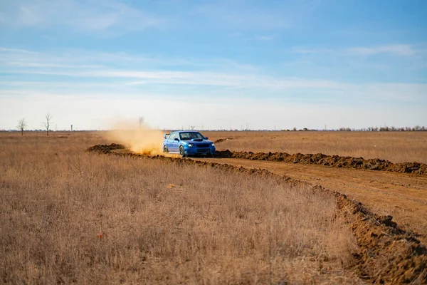 A rally sport car driving on the drit gravel race, fast speed with mud splash — Stock Photo, Image