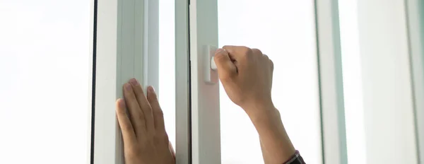 A hand open window to get some fresh air inside the room — Stock Photo, Image