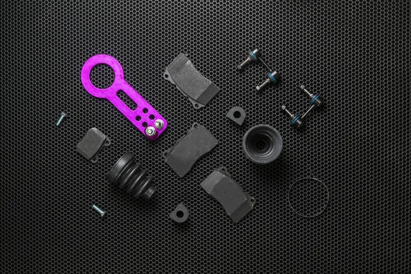 A new car spare parts collection flat lay on dark background, change details service — Stock Photo, Image