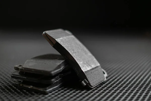 A new sport car brake pads on dark background flat lay —  Fotos de Stock