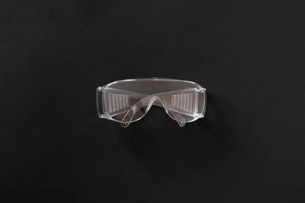 A simple plastic protective eye glasses gear for worker, industrial wear — Stock Photo, Image