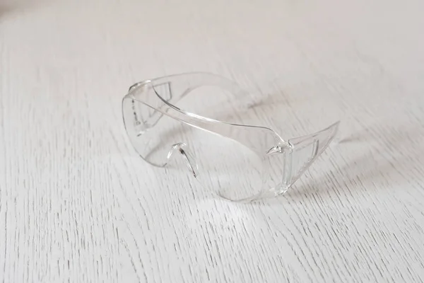 a simple plastic protective eye glasses gear for worker, industrial wear