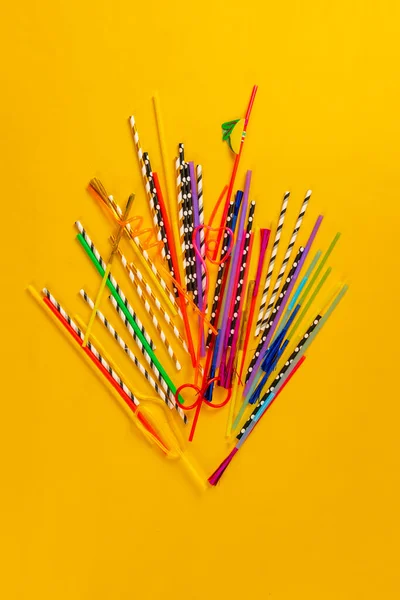 A big collection or set of bunch of different drinking straws flat lay on the table for party — Fotografia de Stock