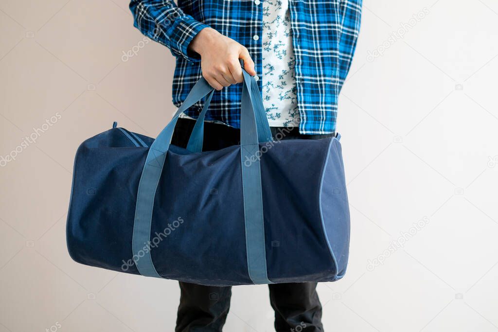 body of a tourist person with big bags full of bags standing and ready to leave for a trip