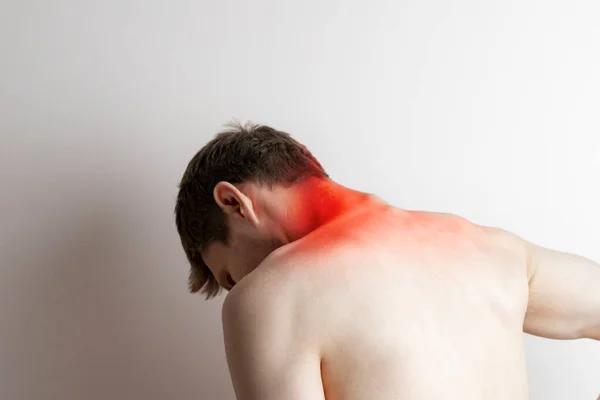 A young man feeling the awful pain, backache concept isolated — Stock Photo, Image