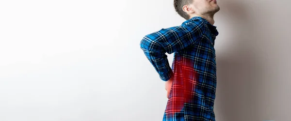 A young man feeling the awful pain, backache concept isolated — Stock Photo, Image