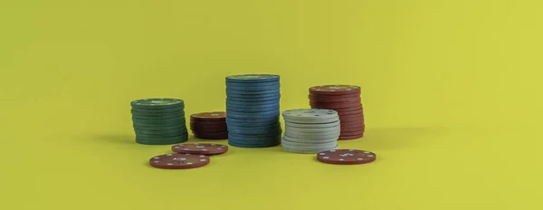 A stack of poker chips in casino isolated against the color background —  Fotos de Stock