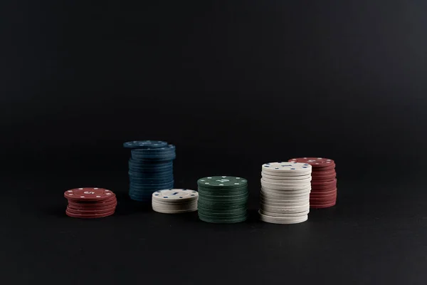 A stack of poker chips in casino isolated against the color background — Stock Photo, Image