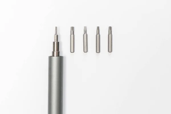 A set of the screwdriver and bits on the table. simple abstract flat lay — Fotografia de Stock