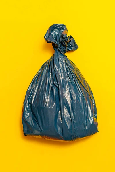 Plastic trash bag package full of rubish on the colorful background isolated, — Stock Photo, Image