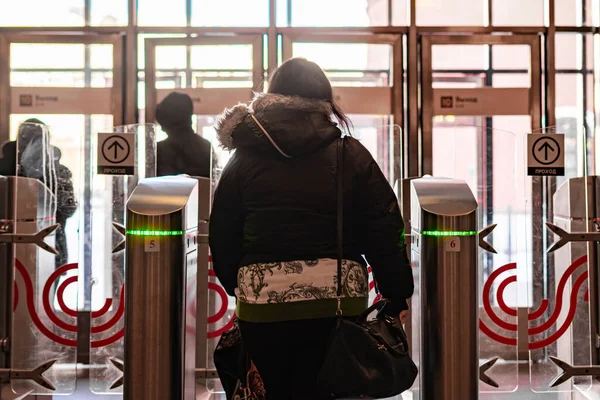 Rear portrait of person go through security turnstile b — 스톡 사진