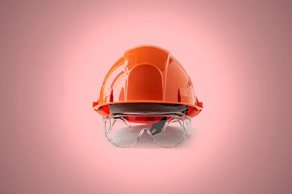 A le casque de tête orange simple, concept minimaliste abstrait du travail de sécurité — Photo