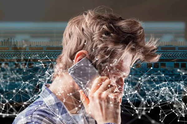 young man communicating via futuristic phone, virtual network hologram b