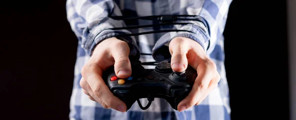 Joystick wire wrapped around persons hands, video games addiction concept b — Stock Photo, Image