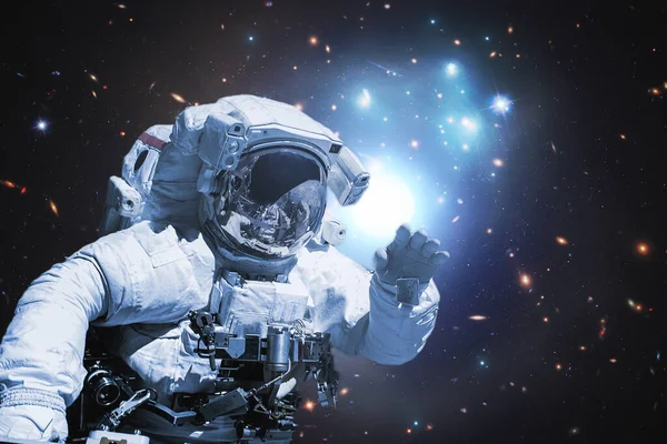 Astronaut walking in outer space, elements of this image furnished by nasa b — Stock Photo, Image
