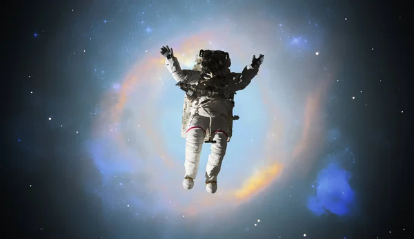 Astronaut walking in outer space, elements of this image furnished by nasa b — Stock Photo, Image