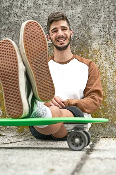 Young Casual Man Sitting Skateboard — Stock Photo, Image