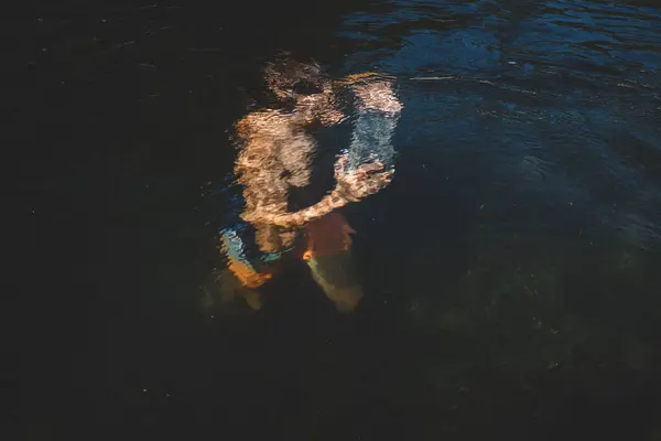 Boy Carries Stone Submerged Rippled Water — Stock Photo, Image