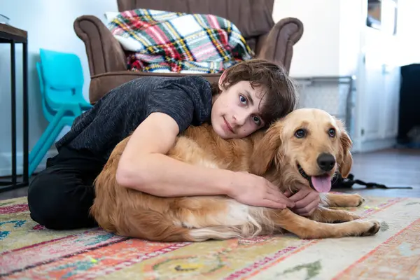 Tween Boy Hugging Golden Retriever — Stock Photo, Image