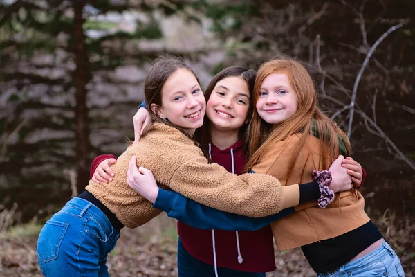 Three Tween Girls Standing Outdoors Hugging Each Other — Stock Photo, Image