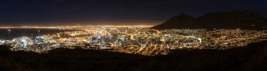 Beautiful panoramic scenic view cityscape of Cape Town, South Africa by night seen from Signal Hill with alienated colors