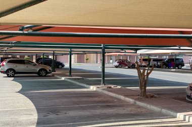 Doha, Qatar  October 1, 2019: Sun protected parking lot in the shade in front of Villaggio Mall, Doha, Qatar, Middle East.